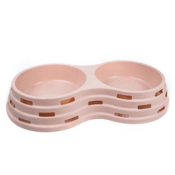 Imagen que muestra el producto Comedero Doble De Mascotas. Comedero doble para mascotas. Material: Plástico Color: Rosado, verde, azul DIsponible: Razas medianas y grandes