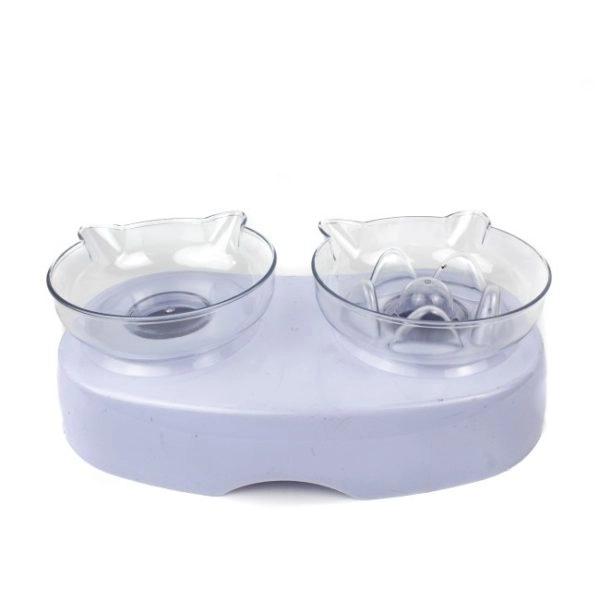 Imagen que muestra el producto Comedero Antirreflujo Para Mascotas. Comedero con sistema antirreflujo, cuenta base y dos tazones. Material: Plástico  Color: Blanco                                                                                                     Disponible: Razas pequeñas. Medidas:  Largo 25cm*Ancho 14cm * Alto 9cm