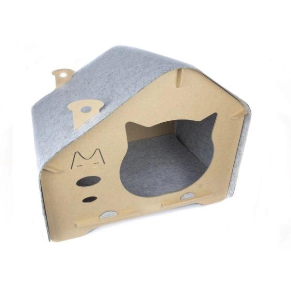 Imagen que muestra el producto Casa  Entrada Gatito Para Mascotas. Casa para mascotas fácil de armar, con entrada en forma de gato, cuenta con un forraje de tela ideal para que su mascota pueda rascarse o afilar las uñas.  Material: Cartón comprimido, tela                                                                                                                                                                                                                                                                                                    Color: Disponible en la foto                                                                                                                                                                                                                                        Disponible: Razas pequeñas Medidas: Largo 54cm* Ancho 40cm* Alto 42.3cm