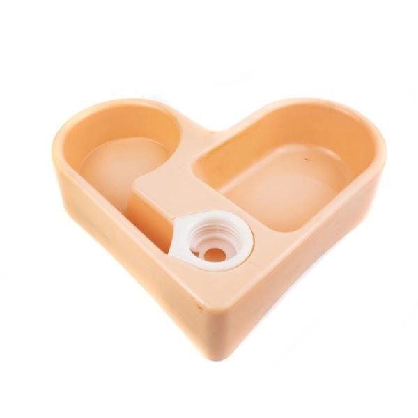Imagen que muestra el producto Comedero Corazón Con Botella Para Mascotas. Comedero para mascotas en forma de corazón, cuenta con dos compartimentos para agua y comida y una botella dispensadora. Material: Plástico Color: Rosado, verde, azul Disponible: Razas pequeñas. Medidas:  Largo 20 cm* Ancho 20 cm*Alto 5.5 cm