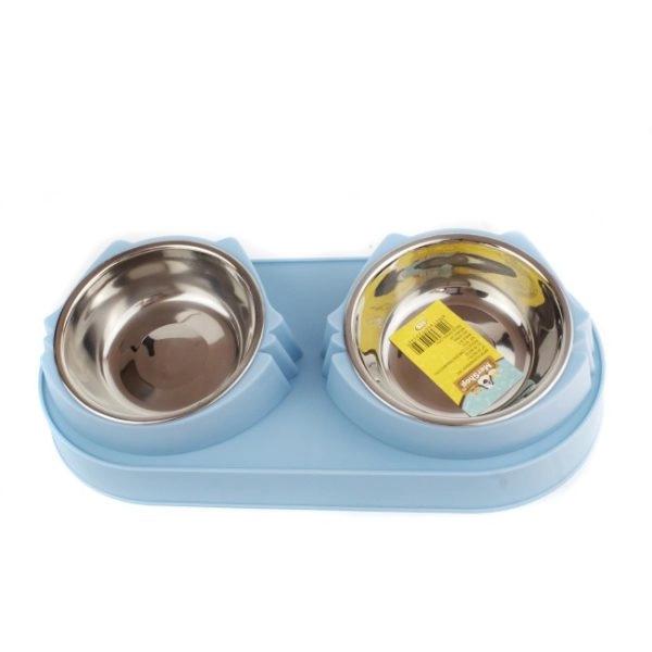 Imagen que muestra el producto Comedero Plateado  Para Mascotas. Comedero para mascotas con diseño de gato, cuenta con dos compartimentos para agua y comida y platos extraíbles para facilitar su limpieza. Material: Plástico , acero inóxidable                                                                                               Color: Azul, verde  Disponible: Razas pequeñas. Medidas: Largo 234 cm* Ancho 8.5cm