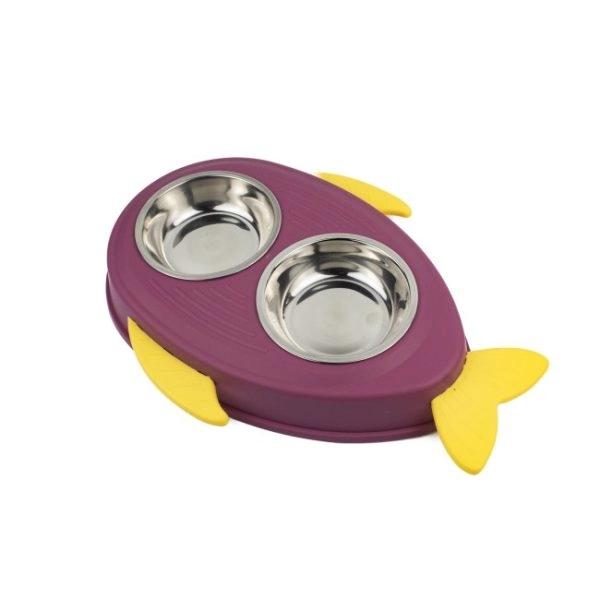 Imagen que muestra el producto Comedero Pez Con Dos Bowl Extraíble Para Mascotas. Comedero doble con diseño de pez, cuenta aletas y dos bowl extraíbles. Material: Plástico, acero inóxidable Color: Verde, azul, morado Disponible: Razas pequeñas. Medidas: