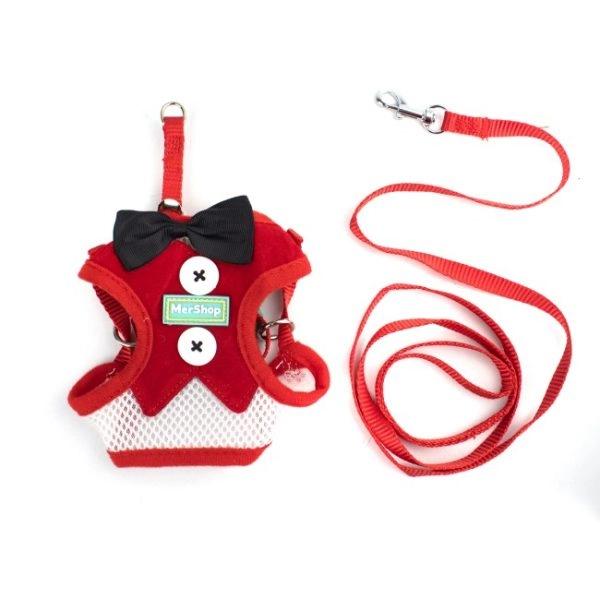 Imagen que muestra el producto Pechera Smoking Para Mascotas. Pechera con corbatín, tejido tipo gamuza y gancho para ajustar a la medida. Material: Poliéster, metal    Color:  Rojo, negro, negro tipo tartán, rojo tipo tartán                                                                                                      Disponible: Razas pequeñas Medidas:  TALLA S: CUELLO 30-41 CM TORSO MIN-MAX 41-53 CM PESO MAXIMO – APROX 5-11 KG, TRAILLA 1,20 CM TALLA M :CUELLO  40-53 CM TORSO MIN-MAX 56-58 PESO MAXIMO – APROX 11-23 KG, TRAILLA 1,20 CM TALLA L: CUELLO 46-66 CM TORSO MIN-MAX 61-76 CM PESO MAXIMO APROX 23-36 KG, TRAILLA 1,20 CM